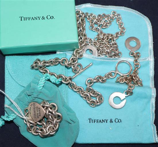 A Tiffany & Co sterling bracelet, a white metal necklace and matching bracelet and a white metal chain.